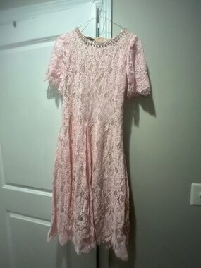 Pink lace dress with pearl decorated neckline